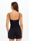 THE UPSIDE women's Black recycled peached Tani Scoop Tank Top features fine elasticated straps with inner shelf bra and removable cups. The perfect wardrobe staple.