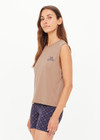 THE UPSIDE women's mocha organic cotton Dawson Tank has a relaxed fit with a soft ribbed neckline and navy varsity logo at chest. Made for everyday wear.