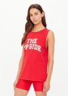 THE UPSIDE women's red organic cotton Jeet Tank Top has a relaxed fit with folded armhole detail and cream varsity logo at chest. Made for everyday wear.