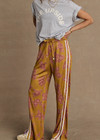 THE UPSIDE women’s floral Fantasy Roma Pant is a true-to-size fit and features an elasticated waistband with a drawcord, side pockets and cream side stripes. The perfect summer wardrobe piece.
