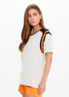 THE UPSIDE women’s cream cotton Elixir Seven Tee is designed for a relaxed fit and features orange and navy stripes on neckline and shoulders. Made for everyday wear.