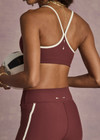 THE UPSIDE women’s red recycled peached Samara Bowie Bra offers a soft & supportive fit and features a scooped front neckline with crossback and removable cups. Made for yoga & pilates.