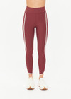 THE UPSIDE women’s red recycled peached Samara 25inch Legging is a soft & supportive fit and features side pockets and contrast cream stripes with curved hem detail. Made for pilates.