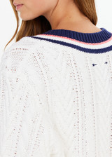 THE UPSIDE women’s cream organic cotton Espada Louie V Neck Sweater is a regular, chunky cable knit design with a navy and rose striped neckline. Made for everyday.