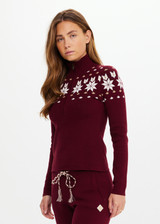 THE UPSIDE women’s maroon organic cotton Le Ski Blanche Half Zip features a zip through opening and a knitted snowflake design across chest and back. Designed for Après-ski and winter wear.