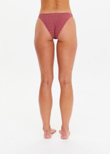 THE UPSIDE women's pink check Aliki Christy Pant has low coverage and is fully lined. Made for swim.