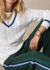 THE UPSIDE women’s white Citta Sonny V Neck Sweater is a fitted, chevron-knit design in organic cotton. The perfect wardrobe addition.