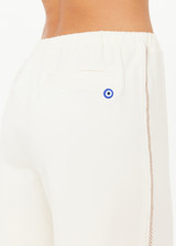 THE UPSIDE women’s creme cotton Hamsa Milou Wide Leg Pant features decorative contrast embroidery along side seams. The perfect travel pant.