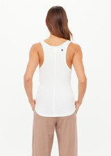 THE UPSIDE women’s white Alyssa Racerback Tank Top features rib fabric, a scoop neck, and embroidered 4-leaf clover at the back. Made for everyday leisure.