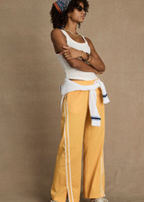 THE UPSIDE women’s white Alyssa Racerback Tank Top features rib fabric, a scoop neck, and embroidered 4-leaf clover at the back. Made for everyday leisure.