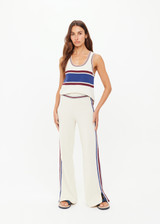 THE UPSIDE women’s creme Adesa Kansas Knit Pant is a wide-leg style featuring short hem splits and a soft elastic waistband. Made for lifestyle.