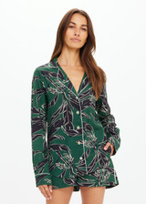 THE UPSIDE women's floral Tamara Rio Collared Shirt is a true-to-size fit featuring a green palm print, pearlised shell buttons and contrast cream piping. Made for lifestyle.
