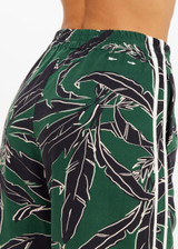 THE UPSIDE women's floral Tamara Juliet Pant is low-waisted with split hem detail and contrast cream side binding. Made for everyday.