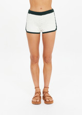 THE UPSIDE women's cream Molokai Lee Crochet Short is fitted with a contrast green elastic waistband and hem, featuring green and cream Yin Yang patch at back. Made for lifestyle.