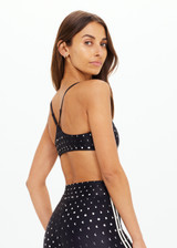 THE UPSIDE women's black Moonstone Zoe Bra offers a soft, supportive fit with a scooped low neckline, T-bar back, and adjustable elastic straps. Made for yoga & pilates.