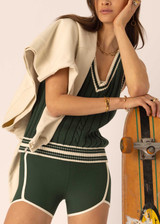 THE UPSIDE women's green Santa Fe Julia V Neck Vest is relaxed fit with chunky cable knit, deep V-neckline, and cream-green striped ribbing. Made for lifestyle.