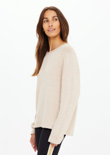 THE UPSIDE women's natural Felice Knit Crew offers a relaxed fit with a silk noil-cotton blend, featuring a ribbed neckline and cuffs. Made for lifestyle.