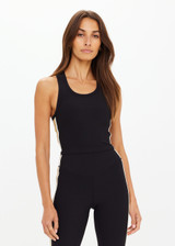 THE UPSIDE women's black Arcadia Sophie Crop Top is supportive and comfortable with a racerback longline design, internal shelf bra, and removable cups. Made for yoga & pilates.