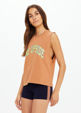 THE UPSIDE women's orange organic cotton Dawson Tank has a relaxed fit, mid length, and a printed lime varsity logo on the front chest. Made for lifestyle.