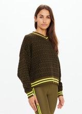 THE UPSIDE women's olive organic cotton Castilla Clementine Knit Crew is designed for a relaxed fit and features a high V neckline with lime-striped rib. Made for lifestyle.