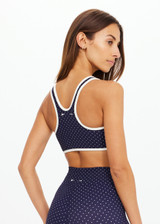 THE UPSIDE women's polka dot Spellbound Jade Racerback Bra is supportive and comfortable with removable cups and contrast cream bindings. Made for yoga & pilates.