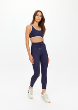 THE UPSIDE women's polka dot Spellbound 25inch Legging is supportive and comfortable with recycled rib fabric, elastic drawcord, and cream aglet ends. Made for yoga & pilates.