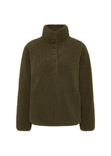 THE UPSIDE women's green recycled polyester Harlow Fleece Pullover is designed for a relaxed fit and features a quarter snap button opening and zip pockets. Made for lifestyle.