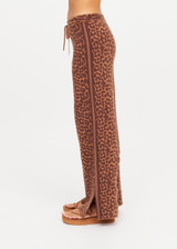 THE UPSIDE women's leopard organic cotton Malawi Freya Knit Pant is true-to-size and features a elasticated waistband with drawcord and short splits at hem. Made for everyday.