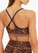 THE UPSIDE women's leopard Malawi Badu Crossback Bra offers soft & supportive fit with a scooped front neckline, crossback straps and removable cups. Made for yoga & pilates.