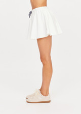 THE UPSIDE women's white tennis, pickleball & padel Daria Skort is made from organic cotton and features an internal short with elasticated waistband and drawcord.