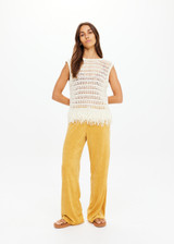 THE UPSIDE women's natural organic cotton Kamali Knit Fringe Top has a loose, boxy fit with scooped low back and knitted fringe detailing at hem. Made for lifestyle.