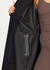 THE UPSIDE women's black James Hooded Trench Coat is a waterproof long line coat and features a fold-a-way hood, magnetic snap closures, an adjustable waist belt and external pockets. The perfect everyday coat.