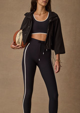 THE UPSIDE women's black Ace Shell Jacket is a water-resistant cropped zip-through jacket and features front pockets and an adjustable drawcord at waist. Made for running.