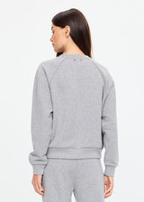 THE UPSIDE women's grey cotton Hit The Road Track Top is a relaxed raglan crew neck sweater in french terry fabrication with a ribbed neckline, arms and cuffs. Made for lifestyle.