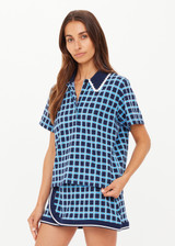 THE UPSIDE women's navy and blue plaid cotton Clubhouse Dom Polo Shirt is a relaxed fit and features a knitted collar with cream crochet detailing on edge. Made for tennis, golf & pickleball.
