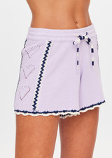 THE UPSIDE women's lilac organic cotton Amara Roller Knit Short is a relaxed fit featuring an elasticated waistband with drawcord and an open knit heart design down sides. Made for tennis, golf & pickleball.