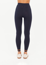 THE UPSIDE women's navy Form Seamless 25inch Legging is firm and supportive and features contrast tan stripes. Made for yoga & pilates.