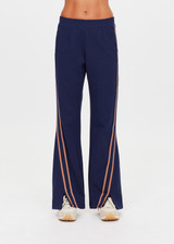 THE UPSIDE women's navy Toledo Petra Flare Pant features tan knitted tape down sides, an elasticated waistband, side pockets and splits at hem. Made for everyday wear.