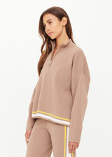 THE UPSIDE women's mocha Veneto Carter Knit Zip Top fits true-to-size and features a half zip and arrow logo on sleeve hem. Made for lifestyle.