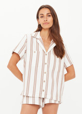 THE UPSIDE women's mocha stripe organic cotton Baja Katia Collared Shirt offers a relaxed fit and features a collar, patch pockets and wooden coconut buttons. Made for lifestyle.