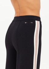 THE UPSIDE women's black Freya Knit Pant has a straight leg fit and features an elasticated waistband  and short splits at hem. Made for lifestyle.