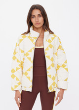 THE UPSIDE women's yellow organic cotton Etoile Carmen Quilted Jacket fits oversized and features front pockets, an elasticated hem and zip through opening. Made for lifestyle.