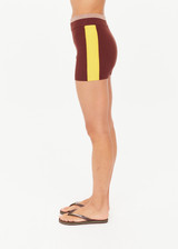 THE UPSIDE women's brown Montage Speechless Short offers a mid-rise fit with a soft waistband and features yellow side pannels, embroidered and rib detail. Made for yoga & pilates.
