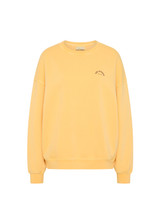 THE UPSIDE women's yellow organic cotton Paradise Coolum Crew is designed for an oversized fit, with discreet side seem pockets and ribbed neckline, cuffs and hem. Made for everyday wear.