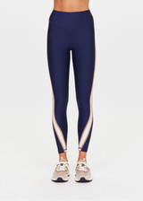 THE UPSIDE women's navy eco tech Toscan 25inch High Legging features a high-rise, breathable design with contrast mocha and cream binds along side seam. Made for yoga & pilates.