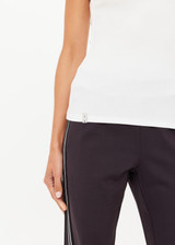 THE UPSIDE women's cream organic cotton Del Rey Pointelle Tank Top features a scooped lace trim neckline with a soft ribbed fabrication. Made for everyday wear.