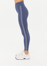 THE UPSIDE women's blue Bowery 25Inch Legging features ultraflex recycled fabrication with a mid-rise and cream embroidered stripes down side seams. Made for yoga and pilates.