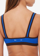 THE UPSIDE women's blue Montage Rory Scoop Knit Sports Bra is mid coverage, with a knitted scooped bra neckline, cream side pannels and a brown elasticated underbust. Made for yoga & pilates.