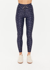 THE UPSIDE women's blue Bellaire 25Inch Legging features a cream star print with a mid rise design, tan striped drawcord and a supersoft recycled fabrication. Made for yoga & pilates.