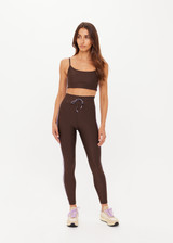 THE UPSIDE women's brown eco tech Oxford Hutton Scoop Sports Bra offers a mid coverage shelf bra with removable cups and adjustable straps. Designed with lilac coloured binds down the side. Made for high impact.